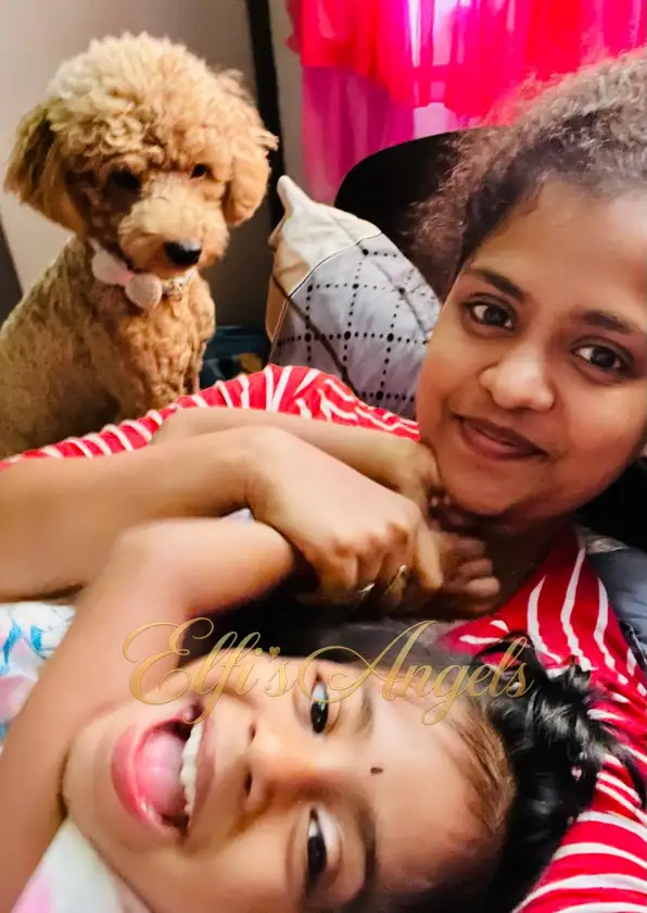 Iniyan with Priya and her family at home